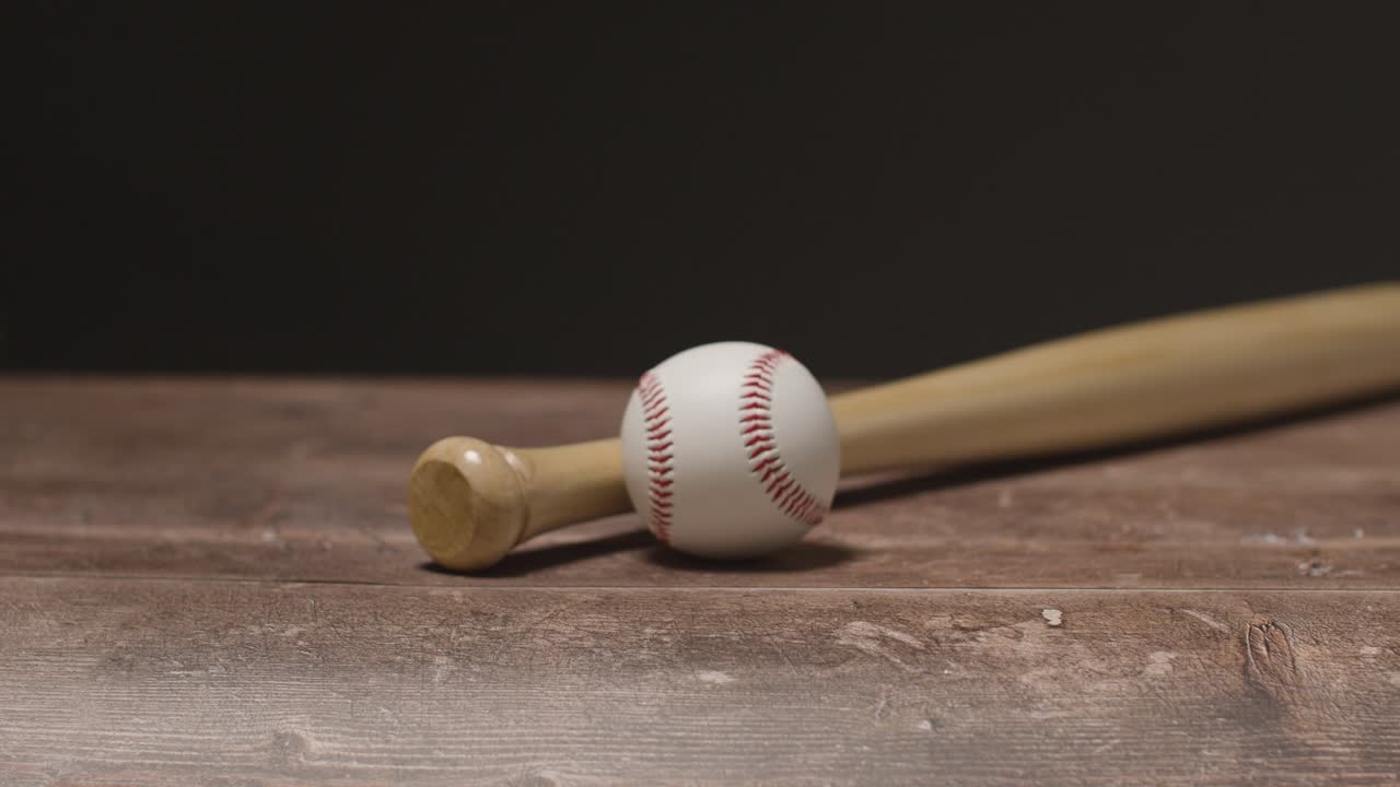 Free stock video Close up studio baseball still life with wooden bat